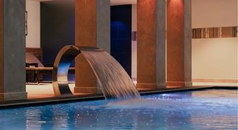 Indoor pool with waterfall, counter-current system, and massage jets