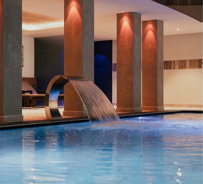 Indoor pool with waterfall, counter-current system, and massage jets